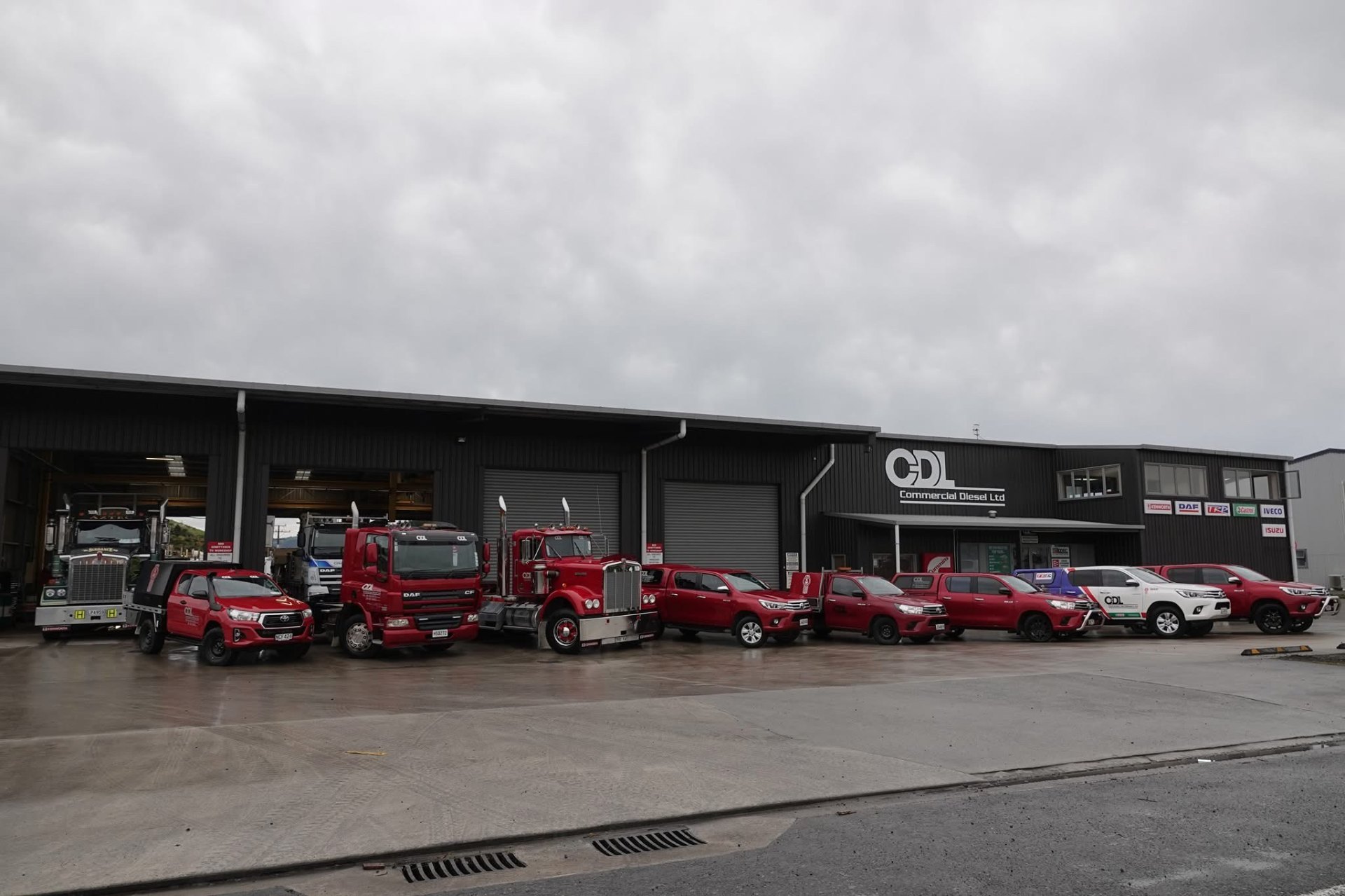Lineup of Kenworth and DAF trucks outside the Commercial Diesel branch
